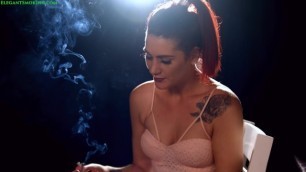 Carly Donna Smoking all White 120s in Front of Black Backdrop
