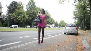 EXHIBITIONIST SLUT IN TIGH DRESS AND HIGH HEELS SMOKING IN THE STREET