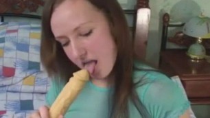 Hot Brunette with natural tits Sucking Dildo